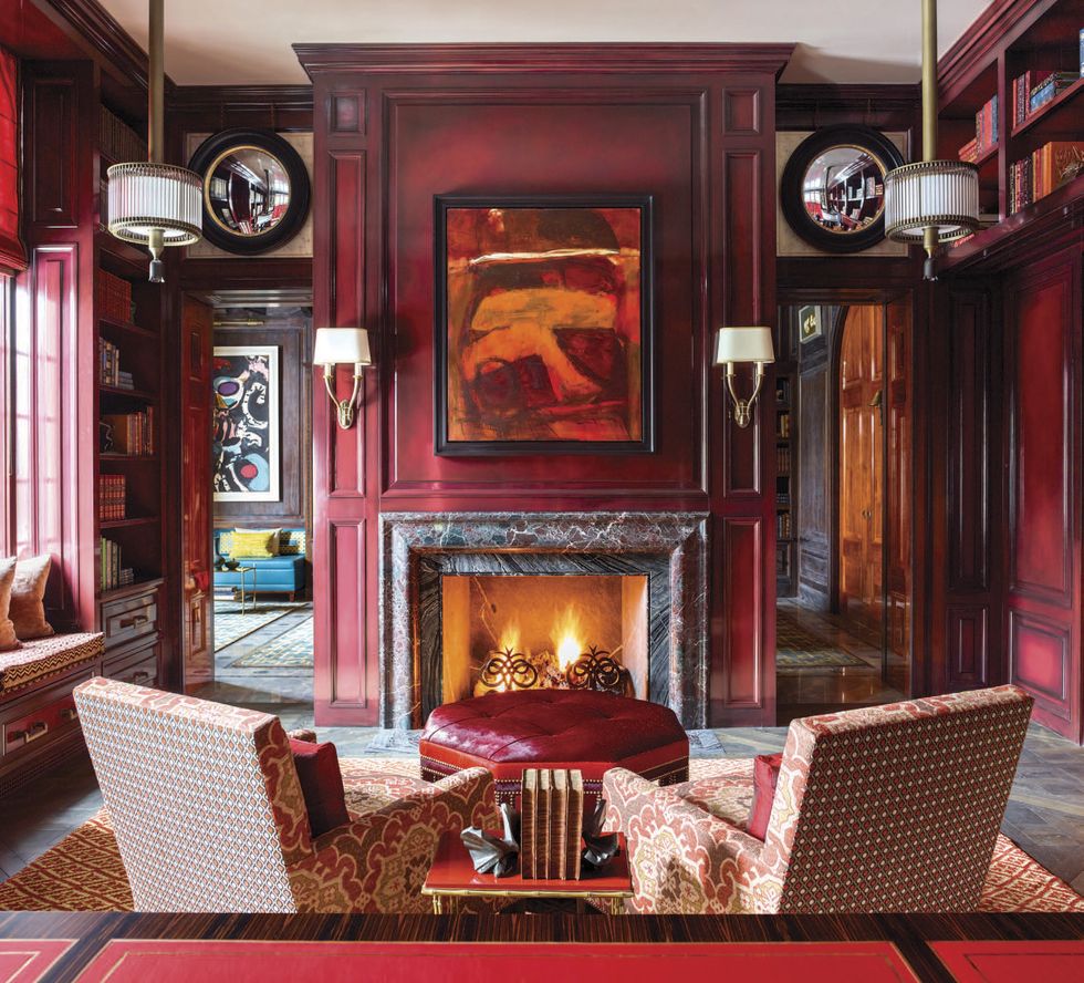 red-hued office with fireplace