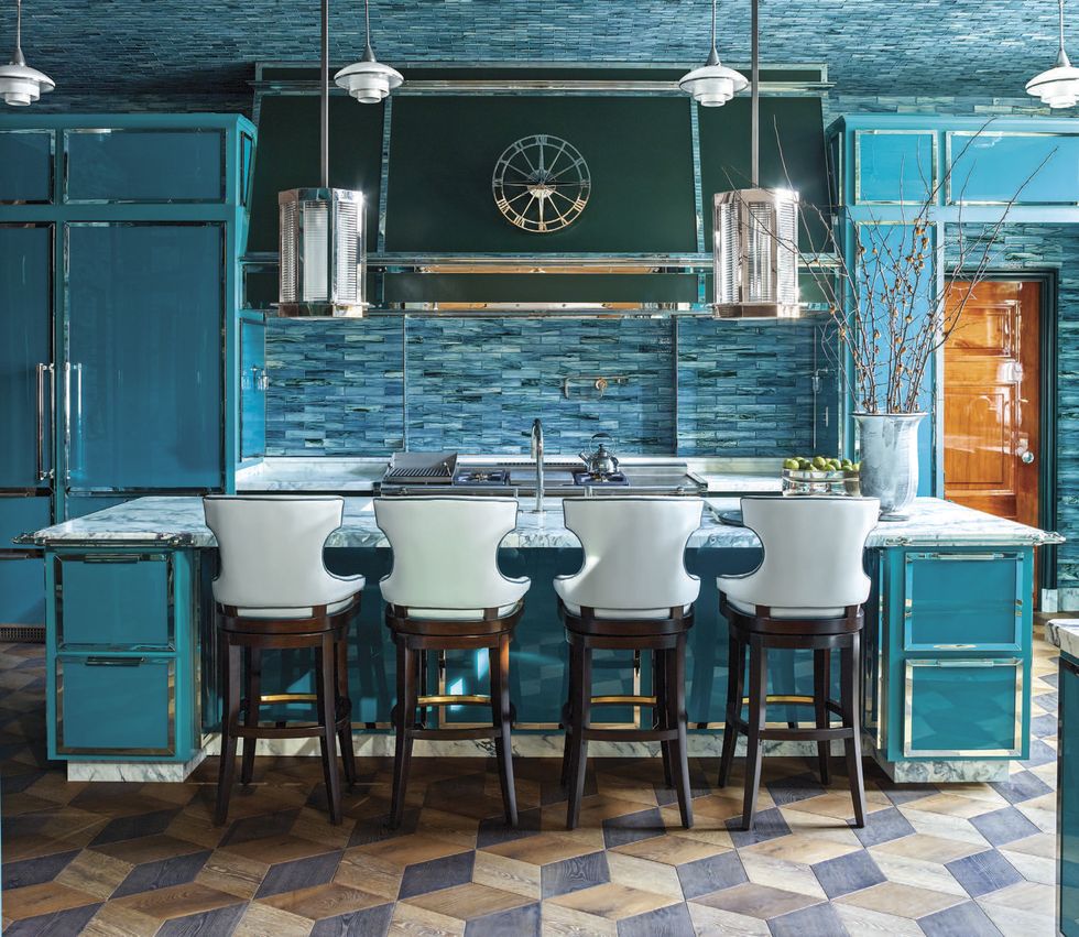 blue kitchen with counter and high stools