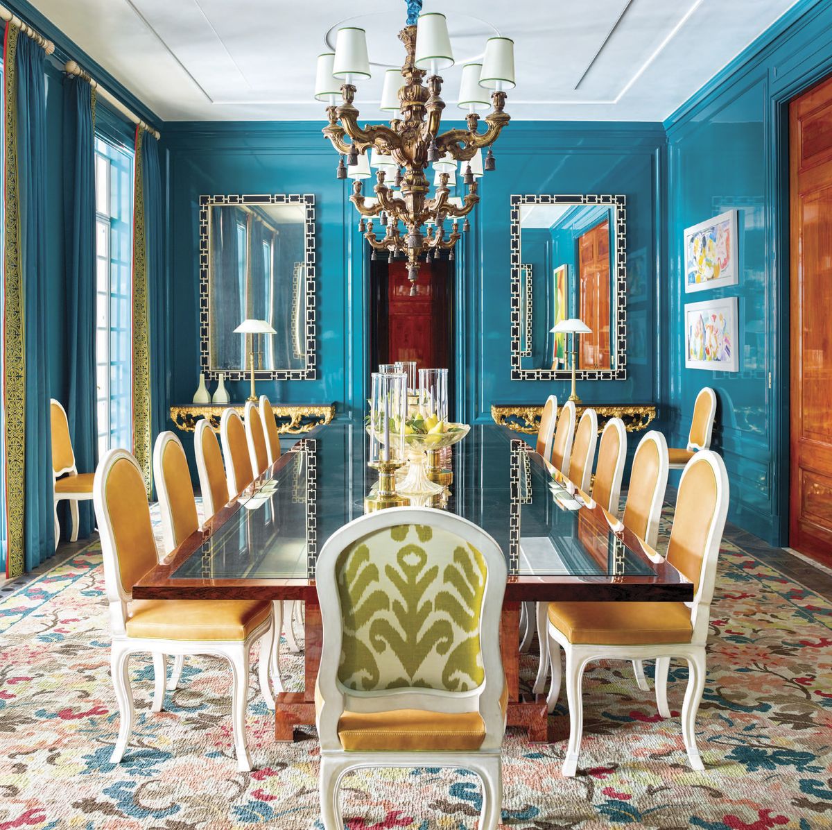 dining room with blue walls and flowered carpet
