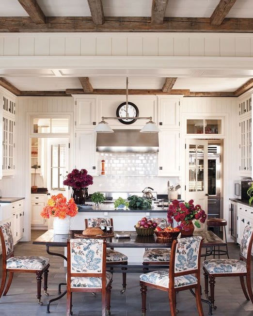 a dining room with a table and chairs