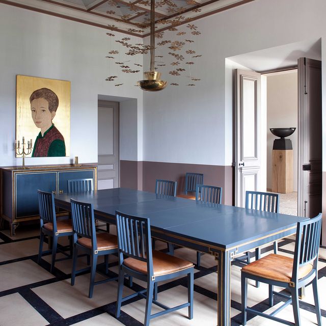 dining room with blue dining table and chairs designed by pierre yovanovitch