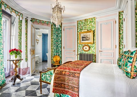 bedroom with green patterned wallpaper