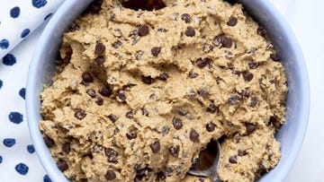 edible cookie dough with chocolate chips in a blue bowl