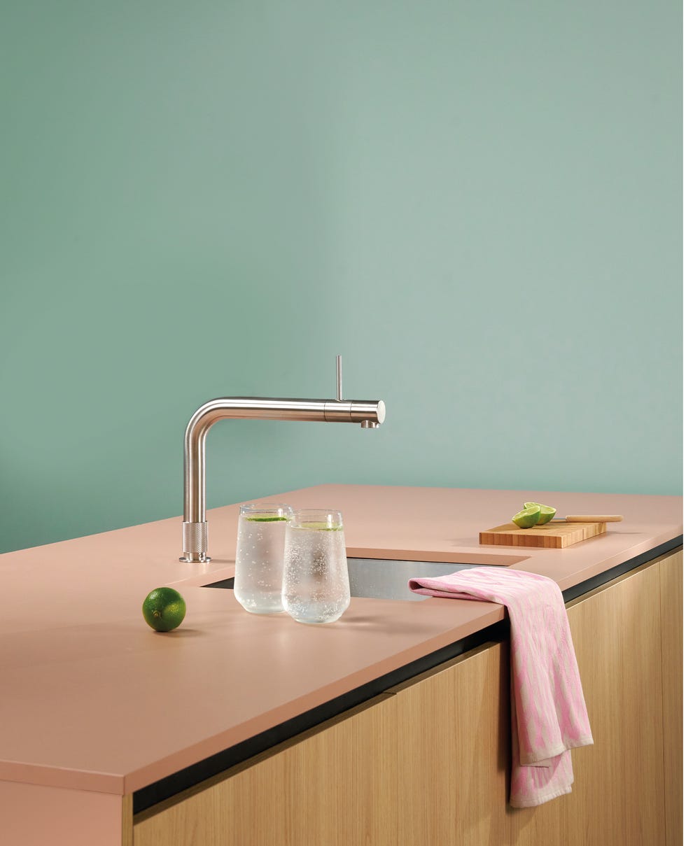 stylish kitchen countertop with modern faucet and refreshing drinks