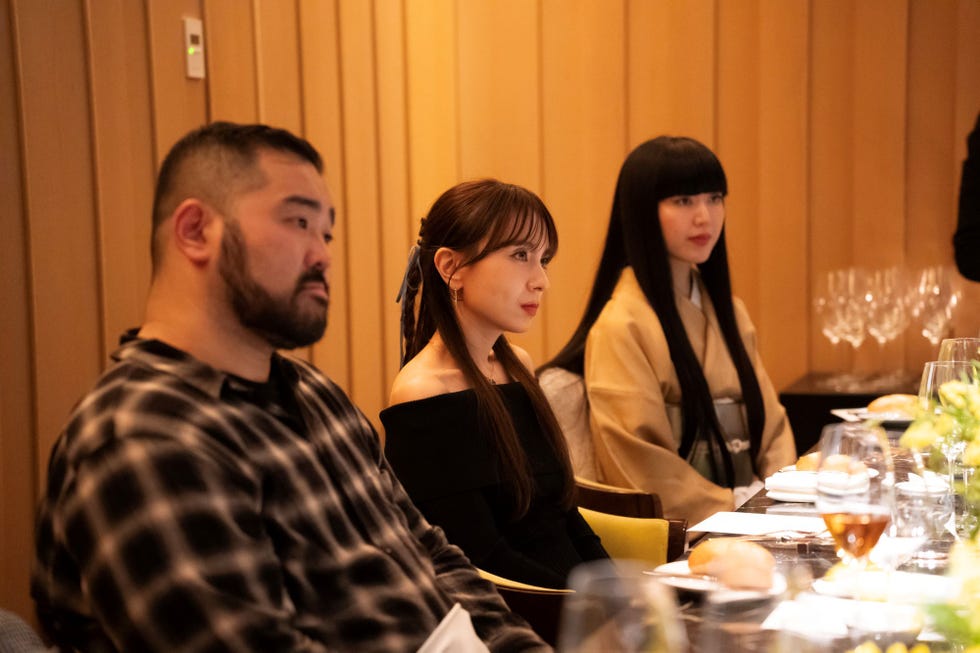 a group of people sitting at a table