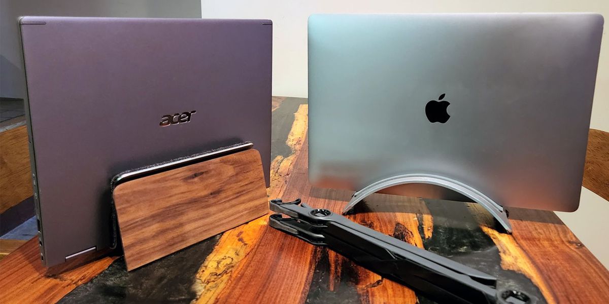 laptop stands holding up an acer laptop and a macbook