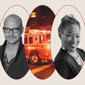 a man and a woman smiling with a fire truck in between them
