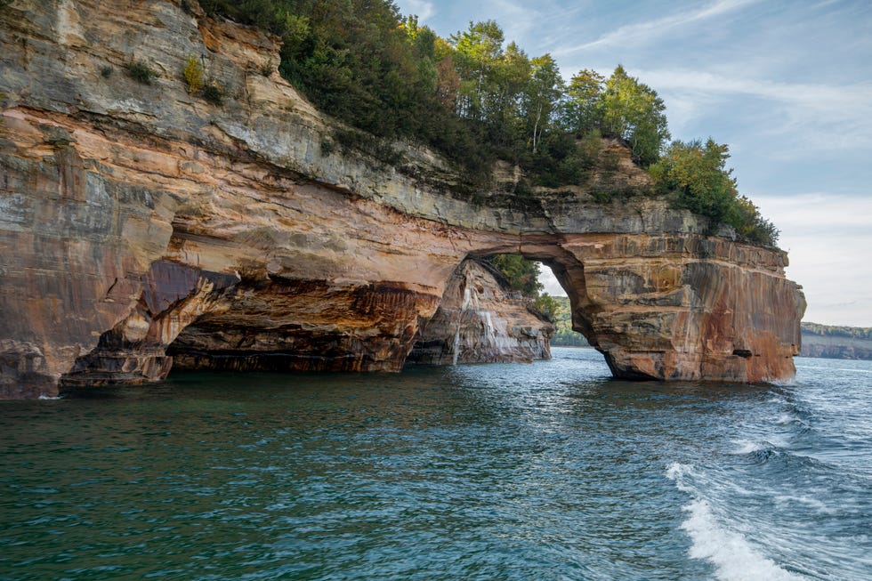 Munising, Michigan, Pictured Rocks National Lakeshore on Lake Superior in the Upper Peninsula of Michigan. The colors in the cliffs are created by the large amounts of minerals in the rock.