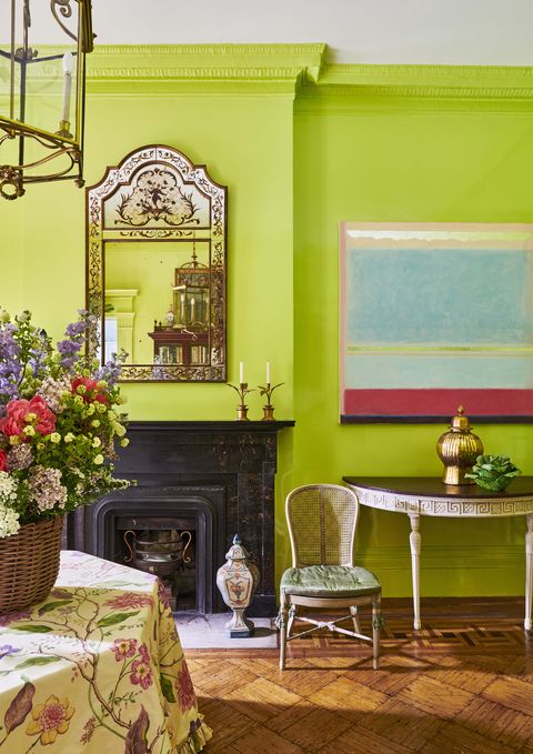a 20th century chinoiserie mirror and contemporary oil painting by margaret kennedy shine atop lime green walls