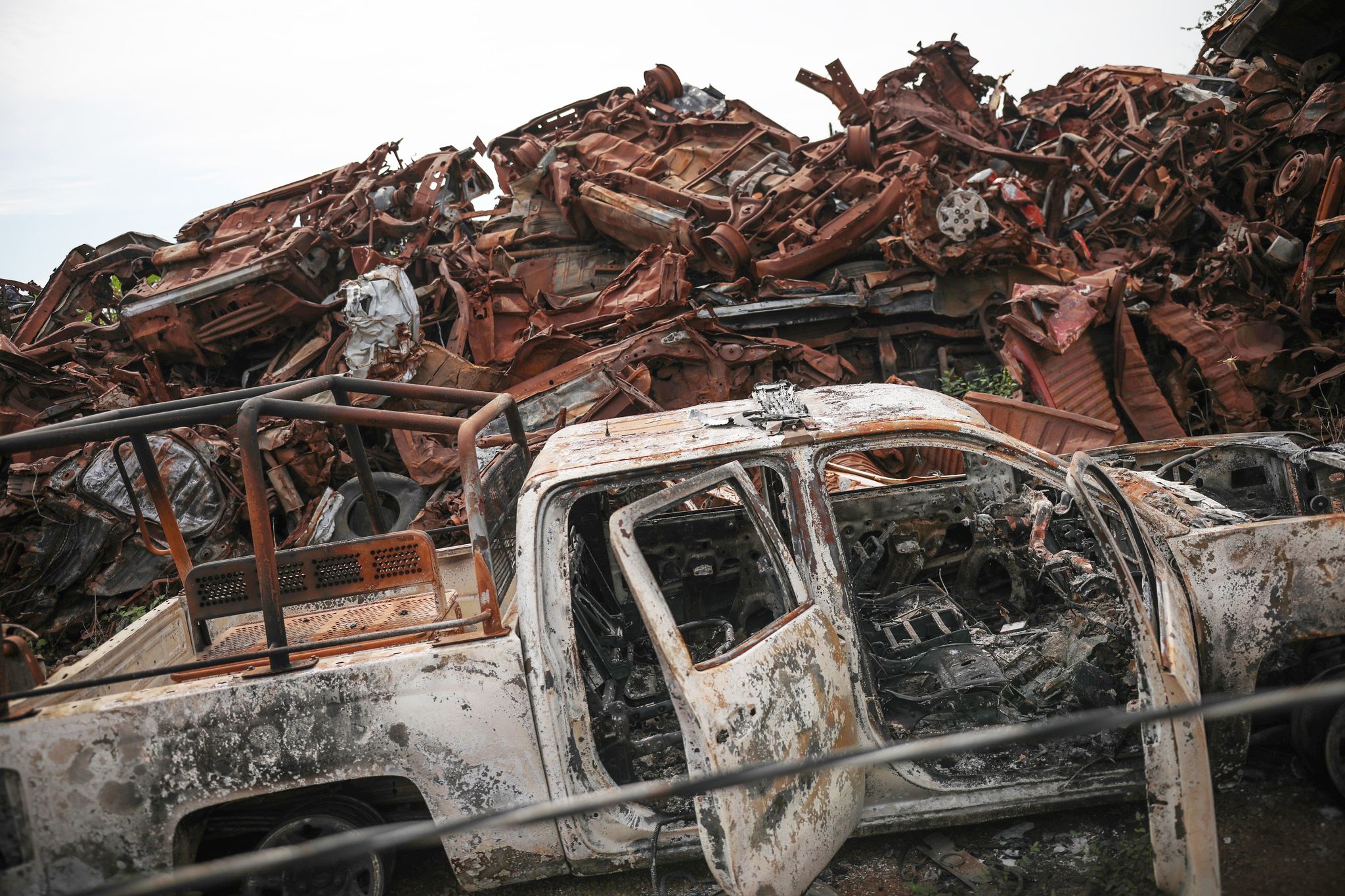 the junkyard where the burned out vehicles were taken following the attack