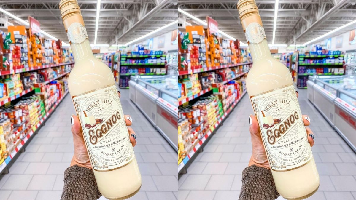 hand holding a bottle of eggnog in an aldi store
