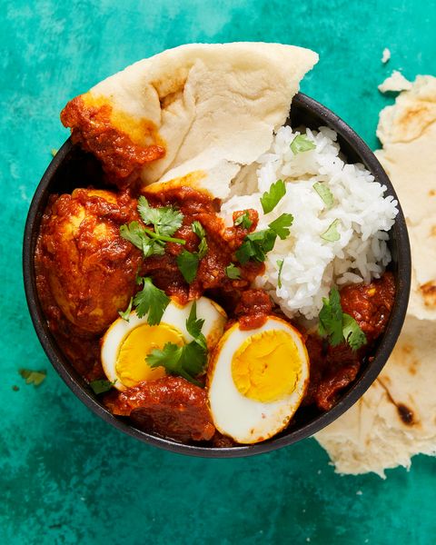 egg curry with naan and rice