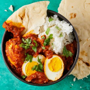 egg curry with naan and rice
