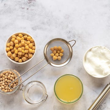 Egg Substitutes for Baking including aquafaba or liquid from canned chickpeas, Greek yogurt and others egg substitutes for baking including aquafaba or liquid from canned chickpeas, pictured with a whisk and greek yogurt