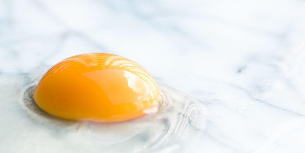 egg yolk on marble recipe ingredients and homemade cooking concept