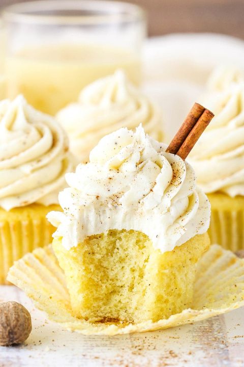 eggnog cupcakes with frosting and cinnamon stick