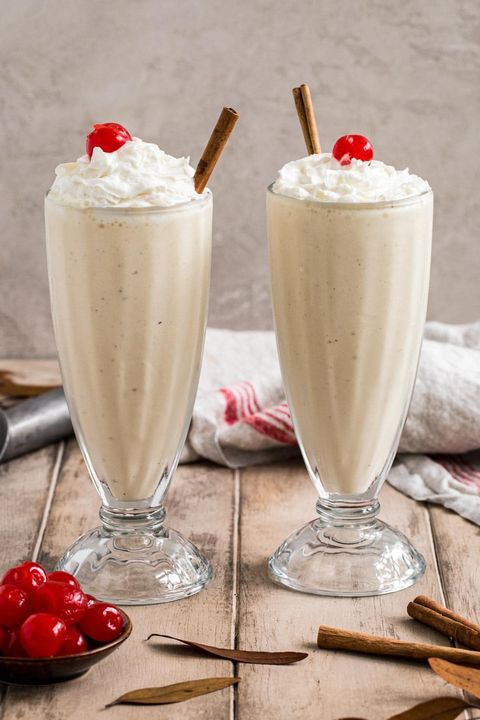 eggnog milkshake in tall glass with cherry