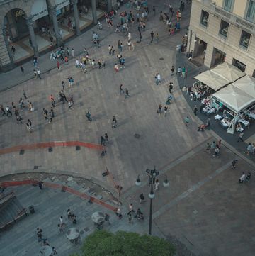 a group of people in a plaza