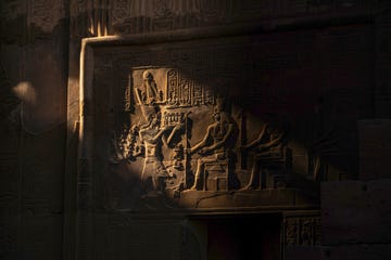 egyptian god and hieroglyphics on the wall