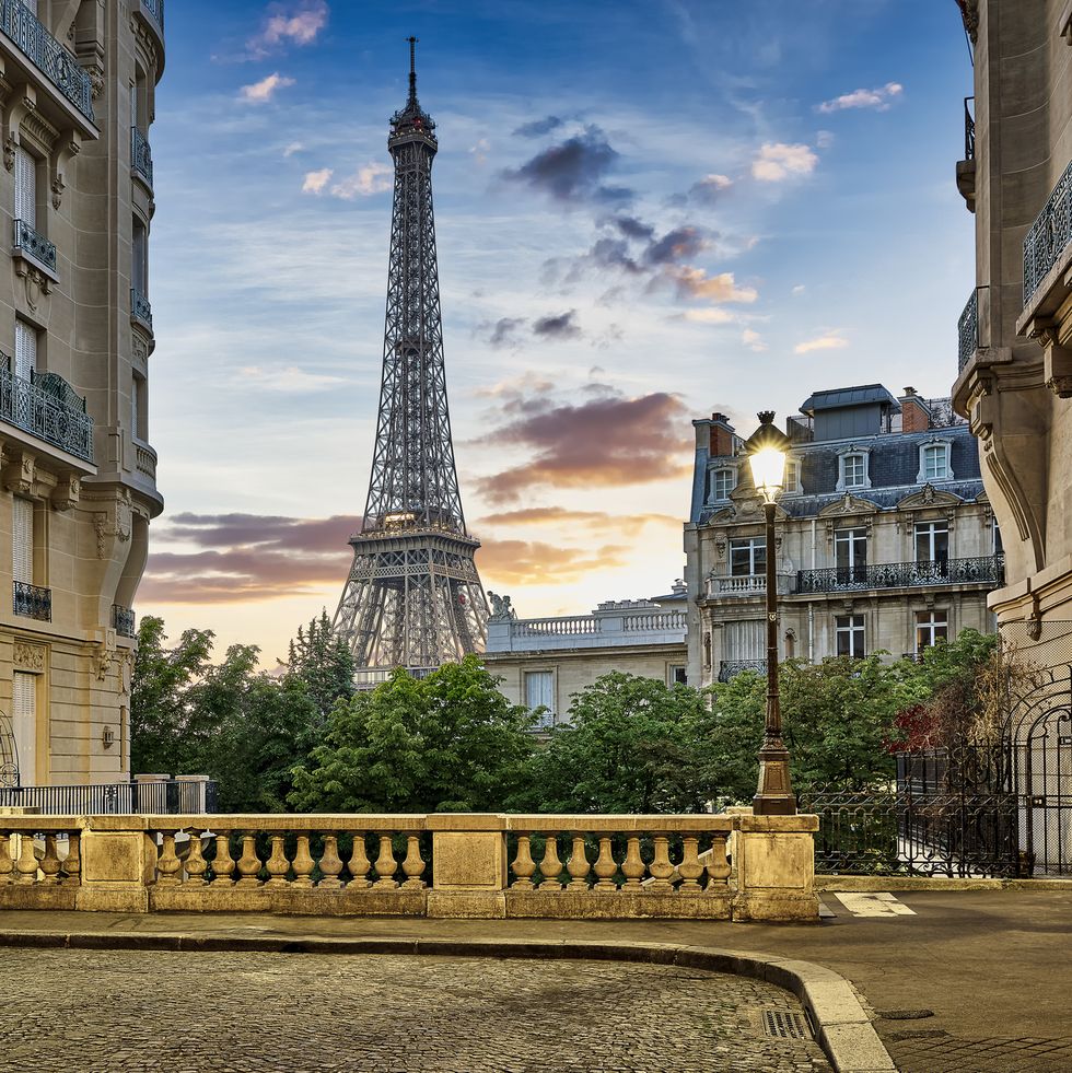 eiffel tower with haussmann apartment buildings in foreground, paris, france
