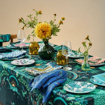 emma j shipley tableware setting plates tablecloth napkins glasses vase flowers green nature inspired designs
