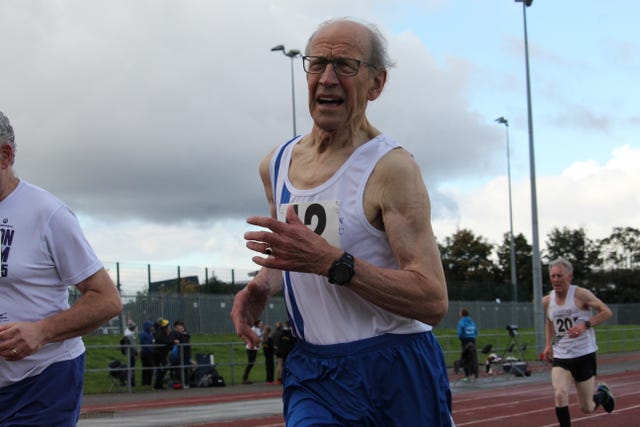 Arm, Track and field athletics, Recreation, Endurance sports, Sport venue, Sportswear, Exercise, Sleeveless shirt, Running, Active shorts, 