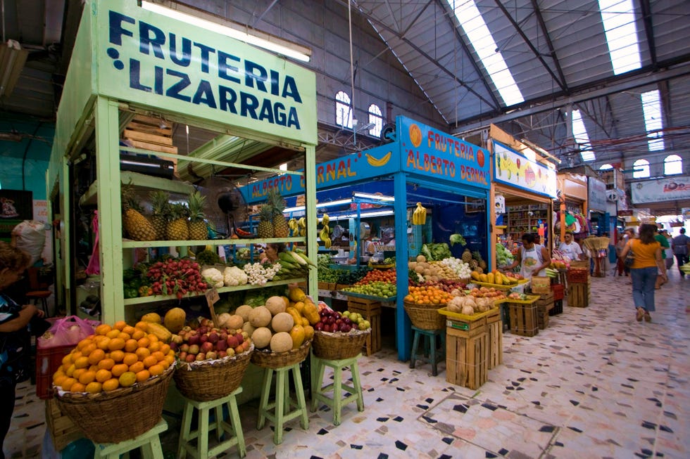 a market with baskets of produce