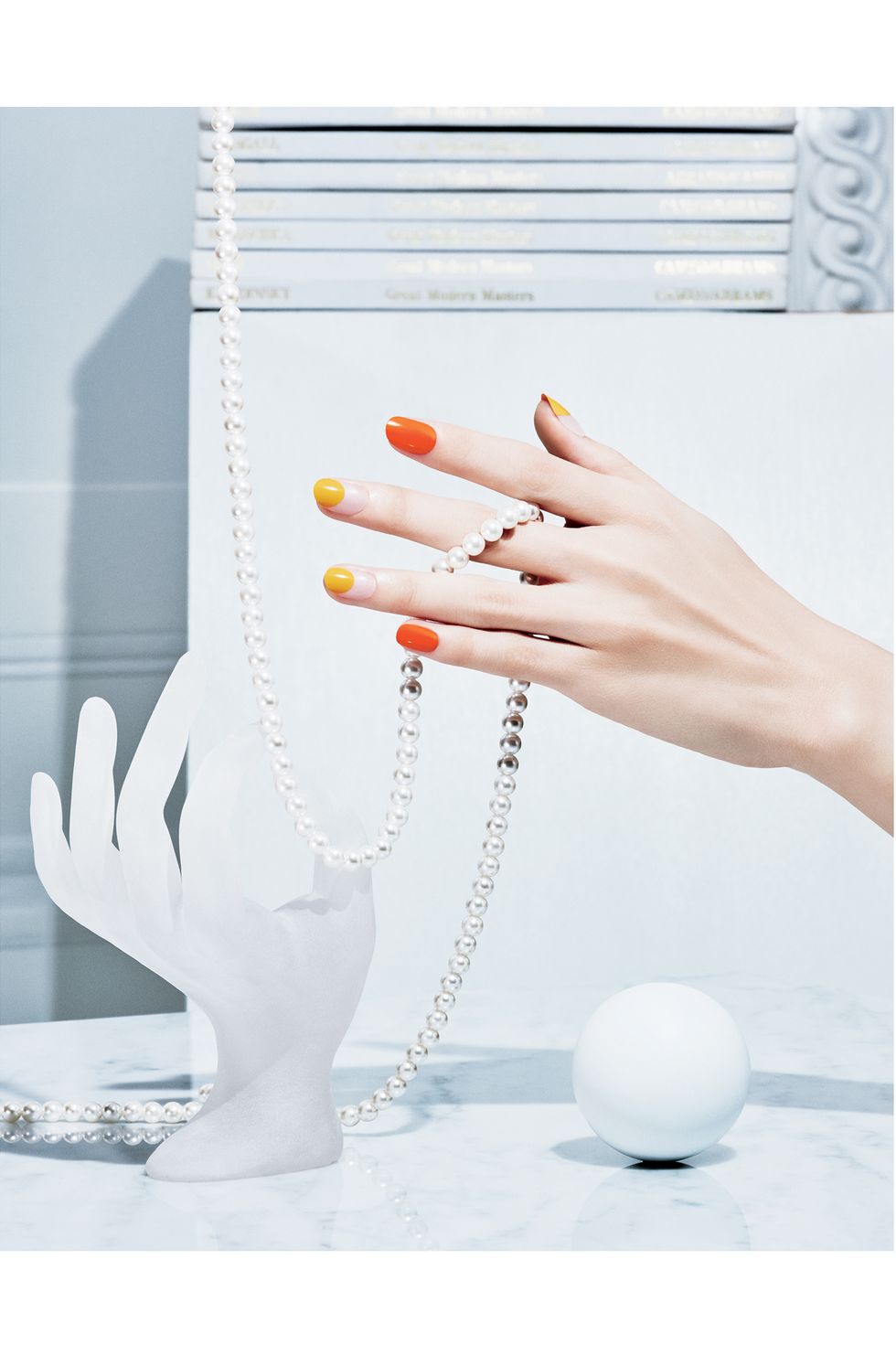 Orange, Hand, Finger, Fashion accessory, Jewellery, Nail, Ear, Glass, Pearl, 