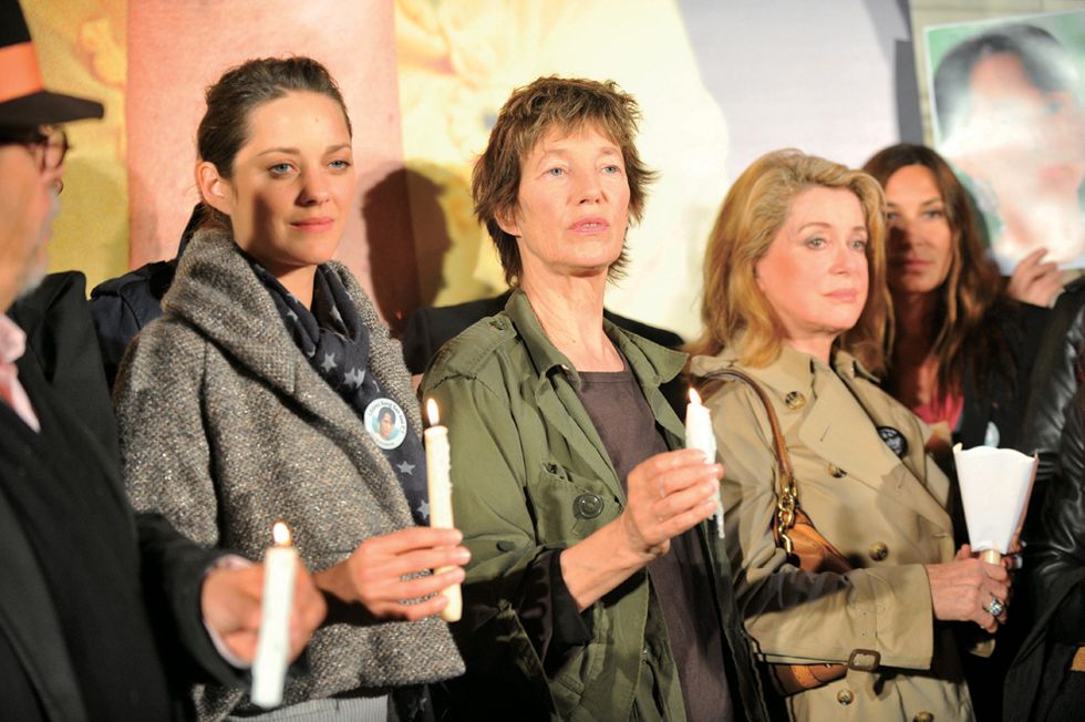 french actresses l r marion cotillard, jane birkin and catherine deneuve participate with other cultural personalities in a silent vigil in support of myanmar's elected leader aung san suu kyi, outside the city hall in paris, france on october 6, 2009 this event was held to call for the release of the nobel peace laureate, who has spent much of the past 20 years in detention judges rejected an appeal by suu kyi against her extended house arrest, on october 2, 2009 photo by mousseabacapresscom