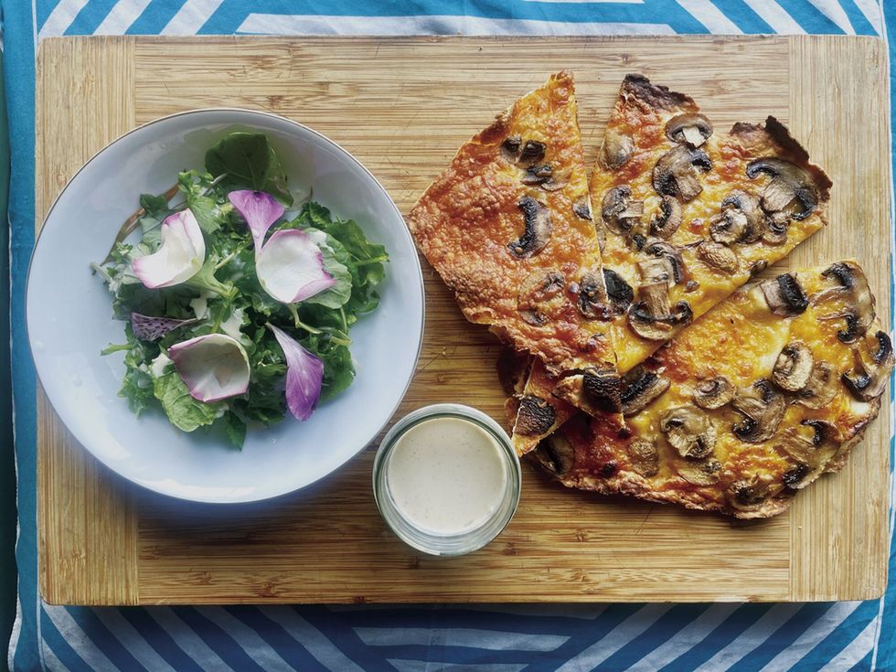 a plate of pizza and salad