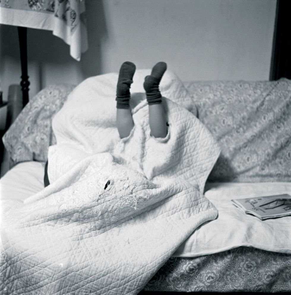 a person lying on a bed