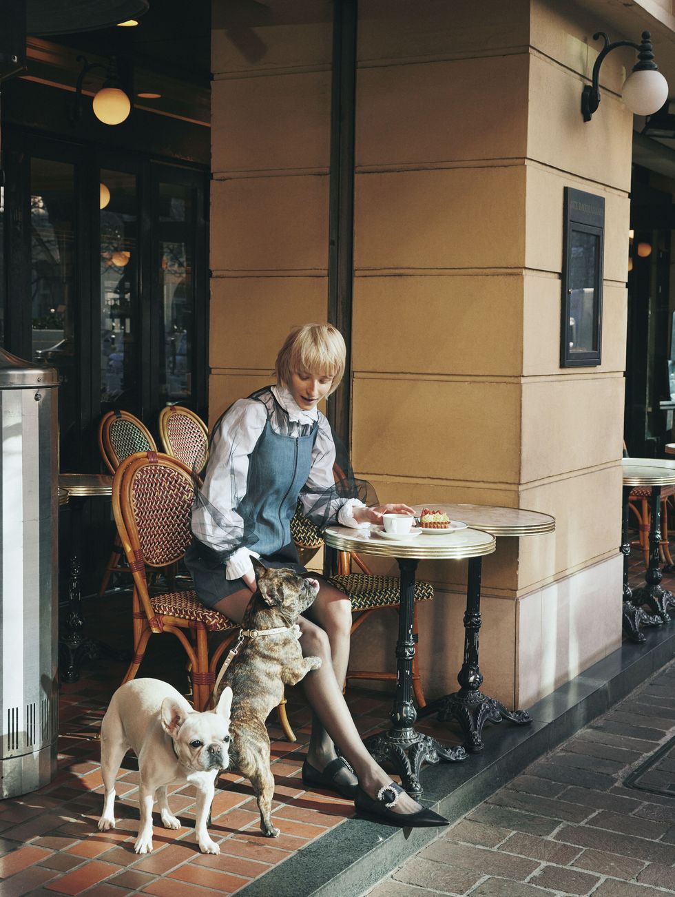 a person sitting at a table with a dog