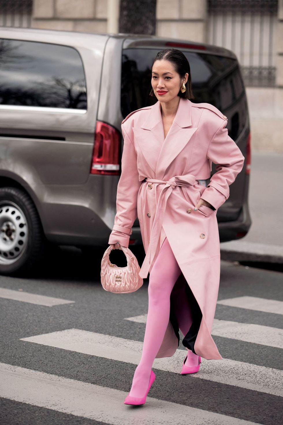 a woman in pink suit