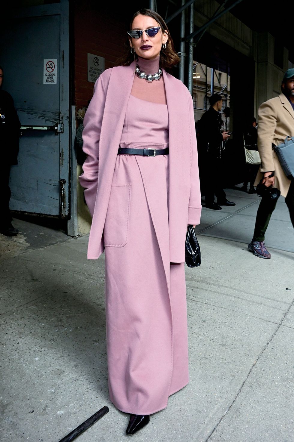 new york, new york february 11 a guest wears a three piece raspberry skirt suit with a shawl collar sweater, matching tank, and a maxi wrap skirt during new york fashion week on february 11, 2024 in new york city photo by shannon finneygetty images
