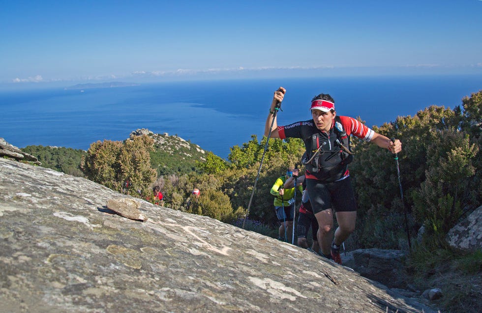 a man with a backpack on a mountain top