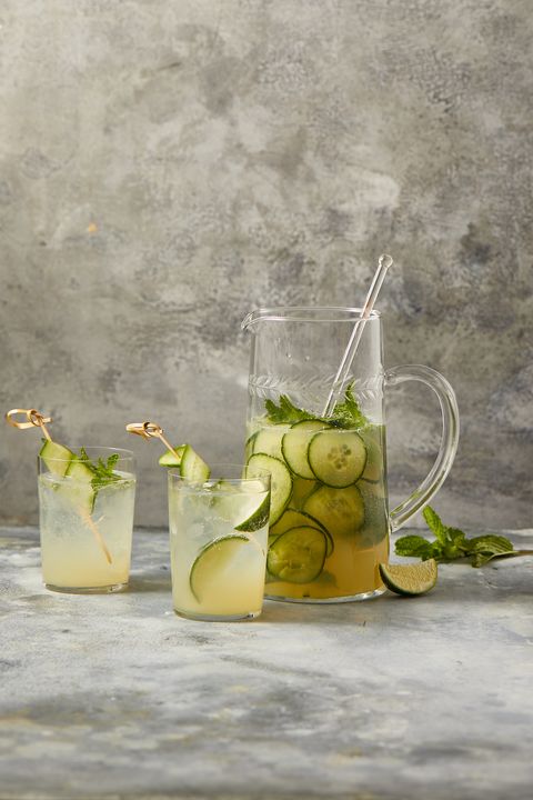 elderflower gin cocktail with cucumber slices in a pitcher