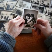 loss of mother quotes elderly hands looking at old photos of self and family
