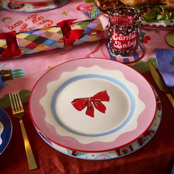Festive dining table set for a celebration with a bow plate christmas bows