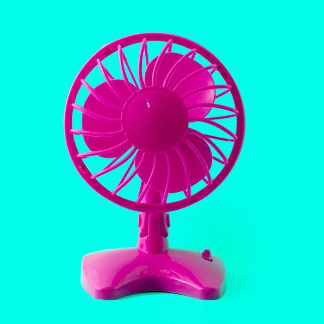 electric retro plastic fan isolated on pastel background