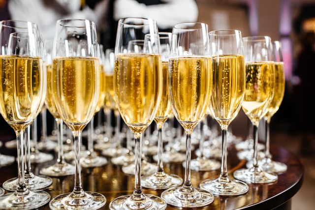 https://hips.hearstapps.com/hmg-prod/images/elegant-glasses-with-champagne-standing-in-a-row-on-royalty-free-image-868336554-1537971833.jpg?resize=640:*