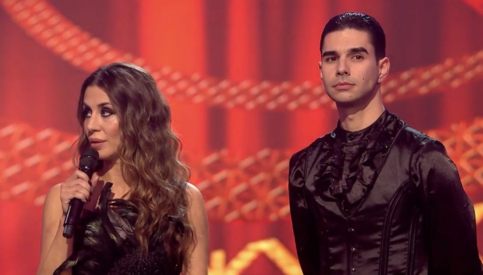 a man and woman holding a microphone