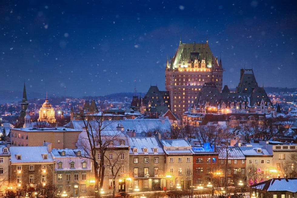 elevated view of the quebec city skyline at night on a snowy winter night