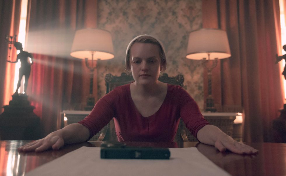 elisabeth moss as june offred, the handmaid's tale