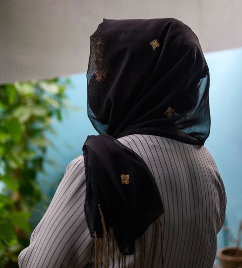 roshana with her back turned wearing a hijab