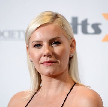 actress elisha cuthbert poses for a photo wearing a black dress in january 2020