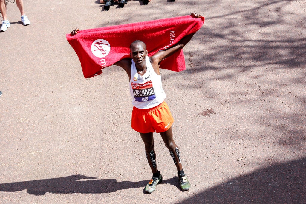 thousands of runners and spectators take to the streets for the london marathon