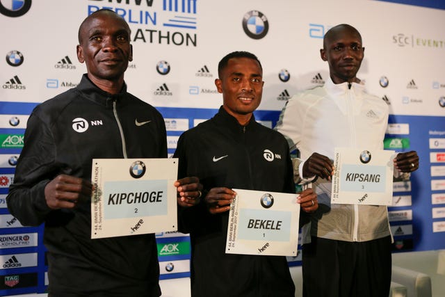 (L) Eliud Kipchoge, (C) Kenenisa Bekele and (R) Wilson...