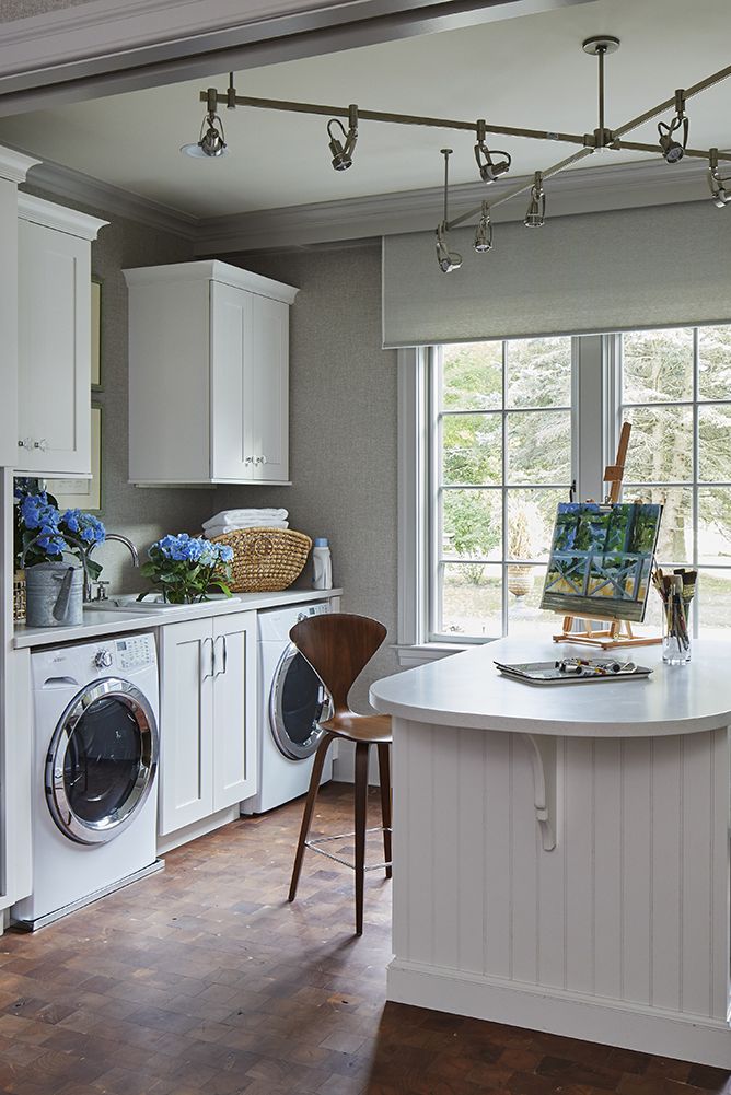 laundry room with counter with art and chair
