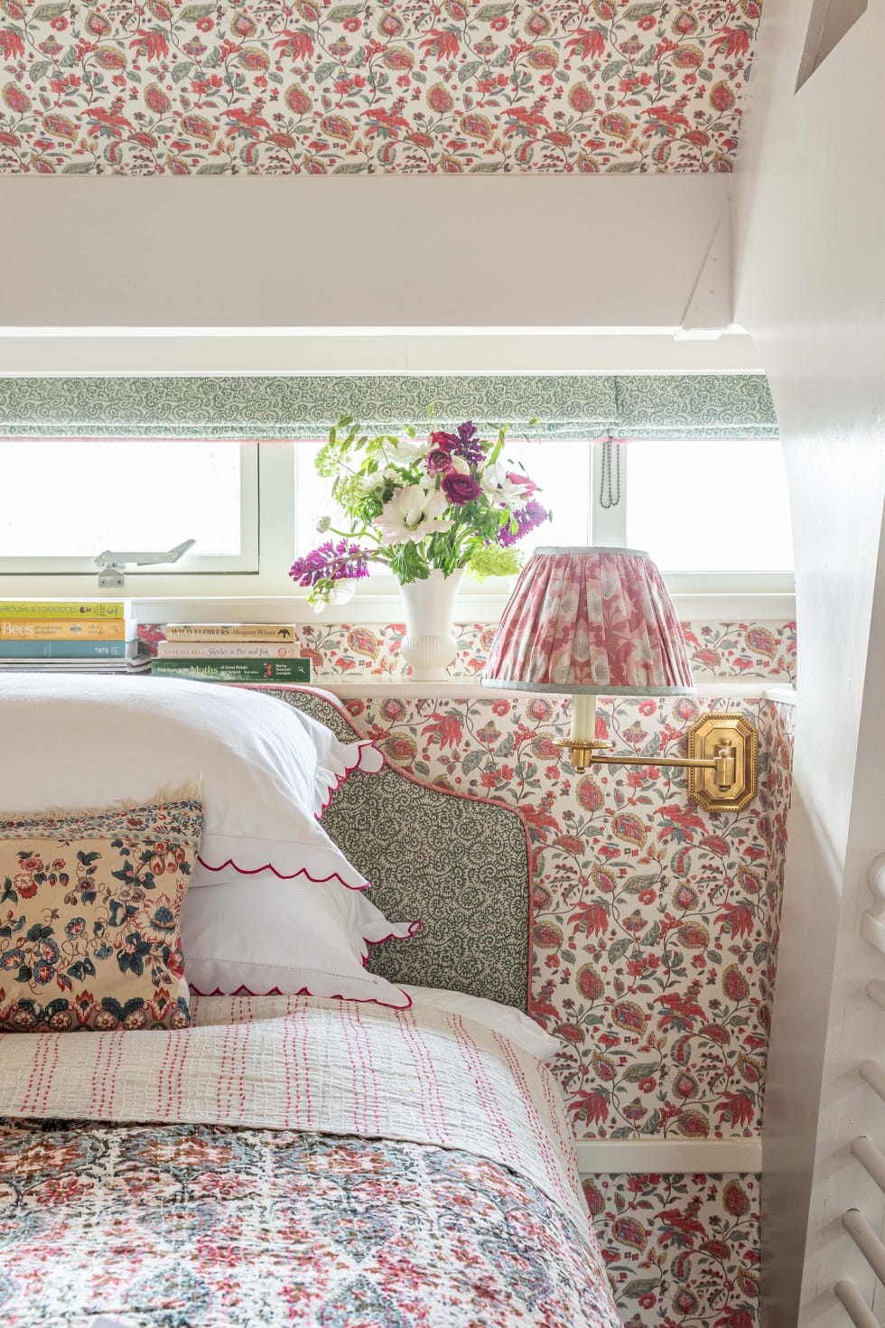 a bedroom with lots of floral patterns