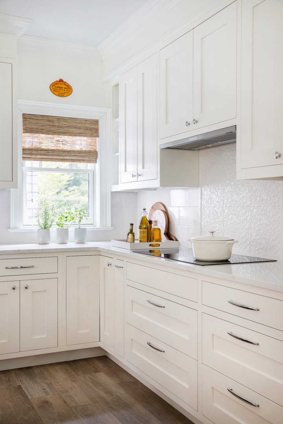 a kitchen with white cabinets